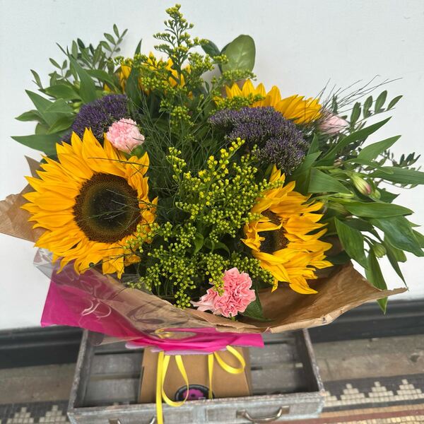 Bright Ideas - Hand-tied of Sunflowers and mixed flowers in water wrapped and presented as you wish.  Sunflowers must be used as part of this design as in the Sunflower Collection.
