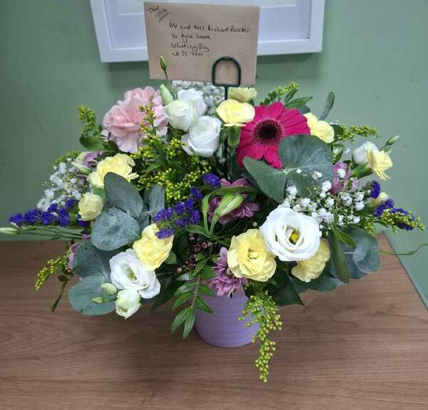 Florist choice arrangement in a pot delivered by The Garden Shop Florist 1 hour ago