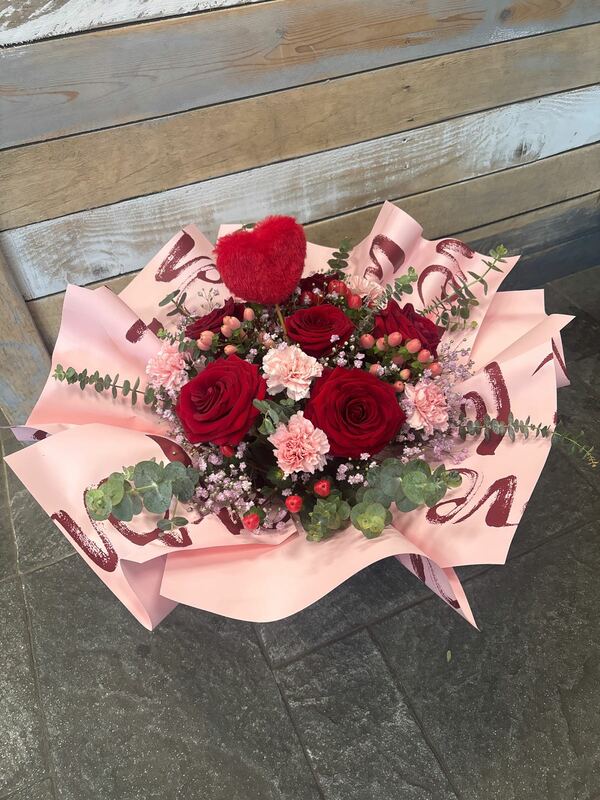 roses and ruffles Delivered by Occasions Florist