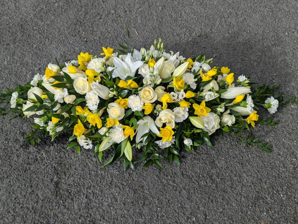white-casket-with-daffs