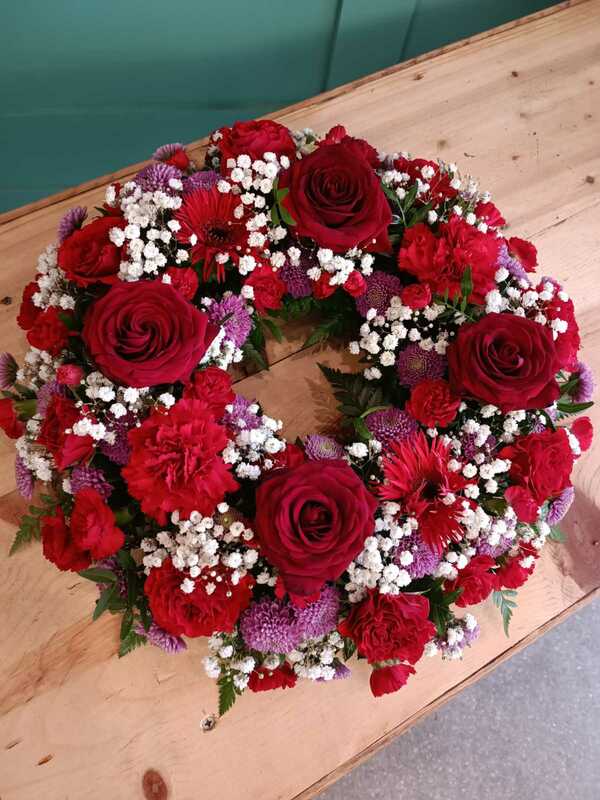 Red wreath delivered by Butterfly in Enniscorthy